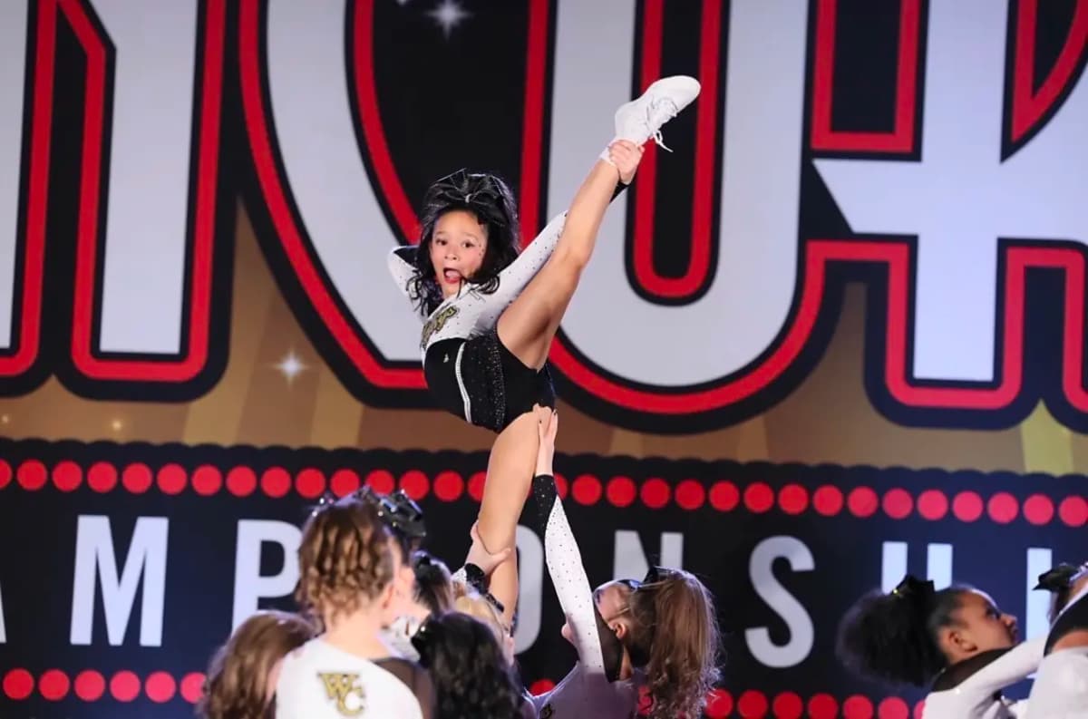 World Cup All Stars cheer athlete competing